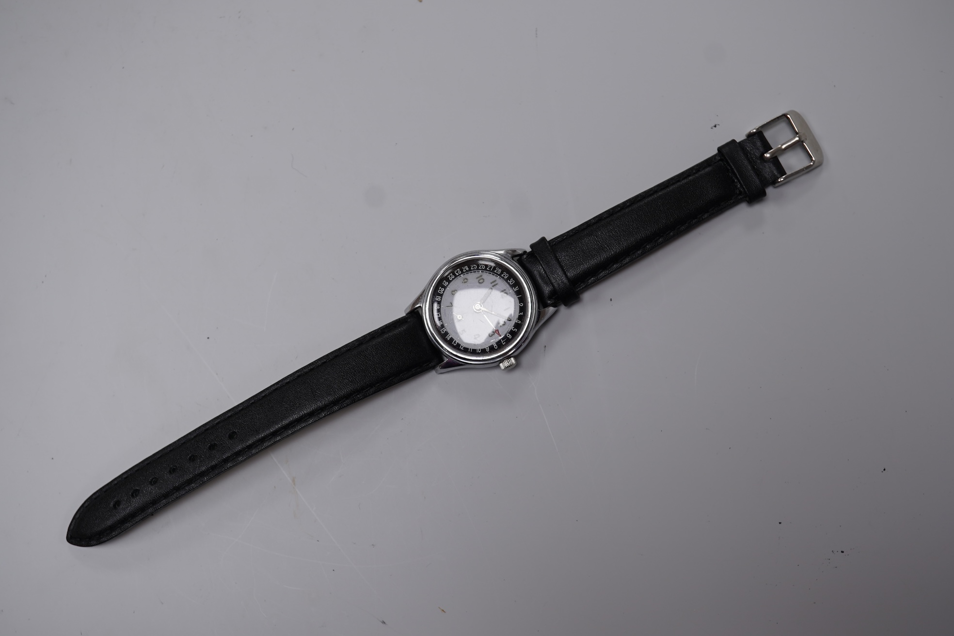 A gentleman's stainless steel backed Oris manual wind calendar wrist watch, with black Arabic dial, subsidiary seconds and date indicator hand, case diameter 32mm, on an associated leather strap, no box or papers.